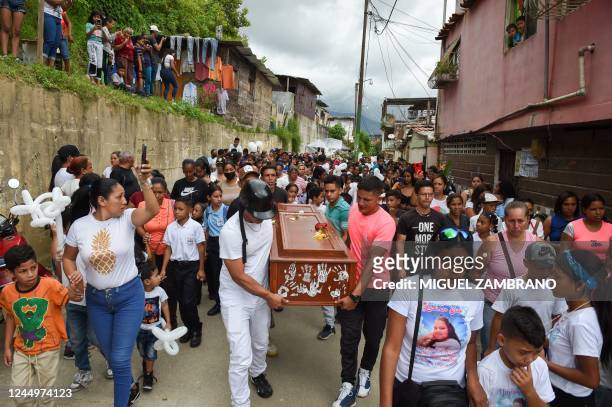 Friends and relatives carry the coffin of Yadimar Sierra, while heading to her funeral from Petare neighbourhood in Caracas, to the cemetery in...
