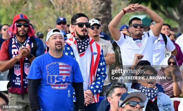 Fans cheer on their team as they watch the Qatar 2022 World Cup Group B football match between the United States and Wales being shown at Dignity...