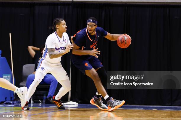 Bucknell Bison center Andre Screen dribbles during the game between the Bucknell Bison and the Presbyterian Blue Hose in the Sunshine Slam on...