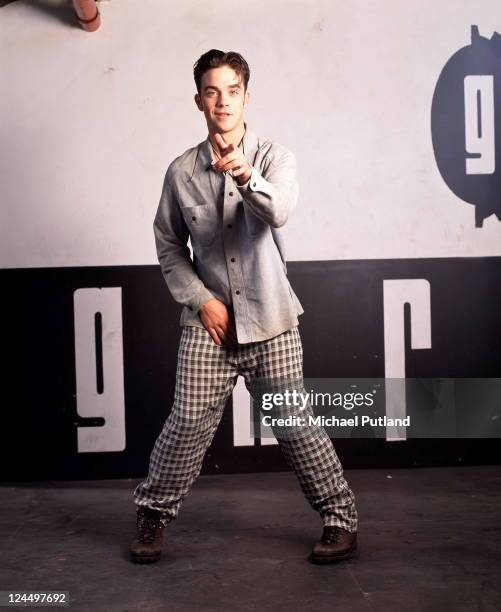 Robbie Williams of Take That, studio portrait, London, 1991.