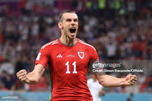 Gareth Bale of Wales celebrates after scoring their 1st goal during the FIFA World Cup Qatar 2022 Group B match between USA and Wales at Ahmad Bin...