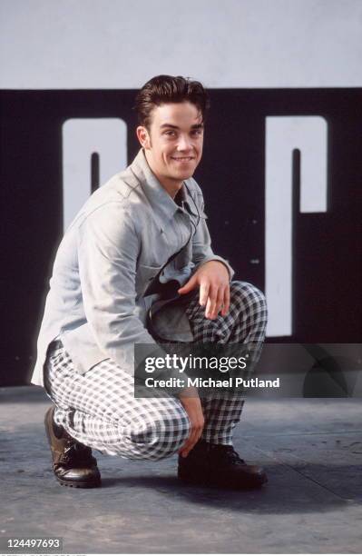 Robbie Williams of Take That, studio portrait, London, 1991.