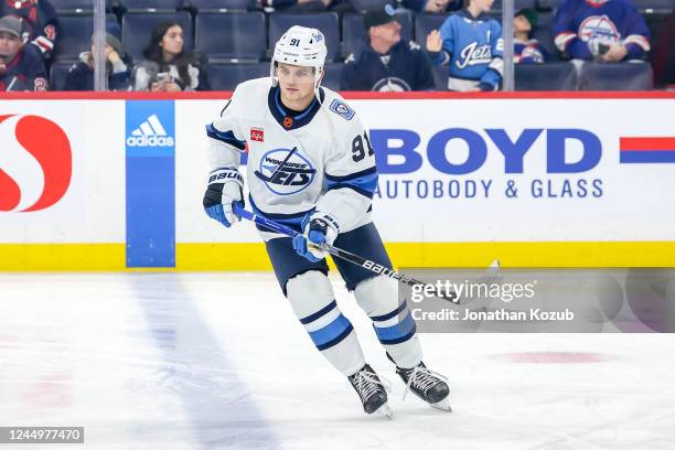 Cole Perfetti of the Winnipeg Jets takes part in the pre-game warm up prior to NHL action against the Carolina Hurricanes at the Canada Life Centre...