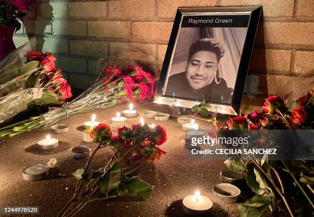 Portrait of victim Raymond Green Vance is seen surrounded by candles and flowers during a vigil for the victims of a mass shooting at Club Q, an...