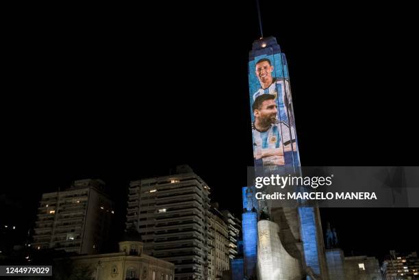 Projection mapping shows images of Argentine football stars Lionel Messi and Angel Di Maria on the "Monumento Nacional a la Bandera" in Rosario,...