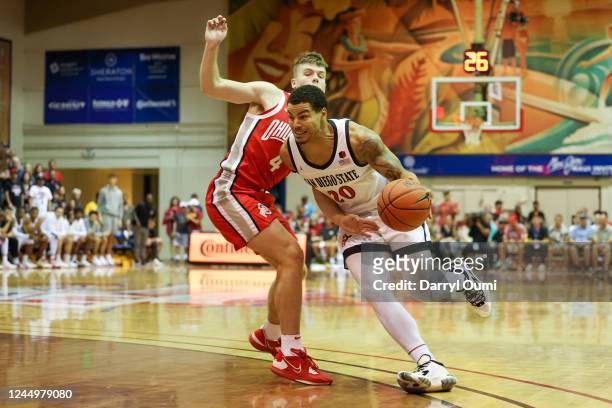 Matt Bradley of the San Diego State Aztecs drives around Sean McNeil of the Ohio State Buckeyes in the first half of the game during the Maui...
