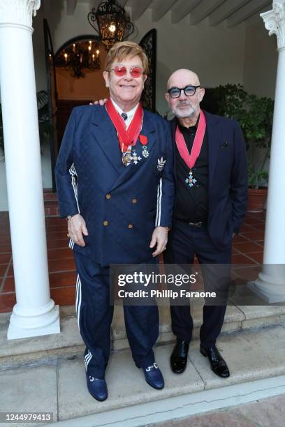 Sir Elton John and Bernie Taupin CBE attend His Majesty's Consul General CBE Medal presentation for Bernie Taupin on November 18, 2022 in Los...