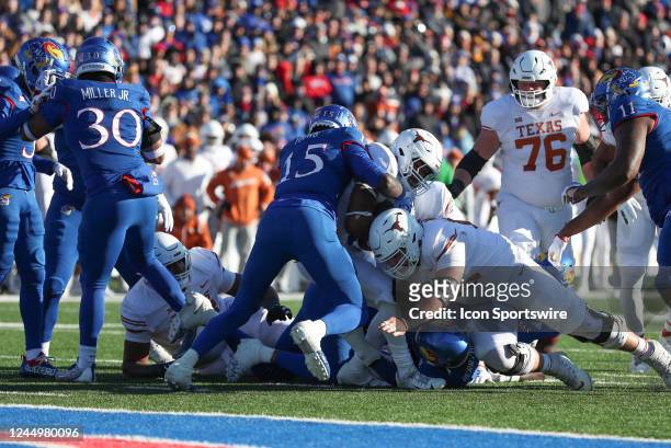Kansas Jayhawks linebacker Craig Young and teammates hold Texas short of the goal line in the first quarter of a Big 12 college football game between...