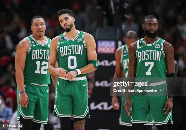 Boston Celtics forward Grant Williams Boston Celtics forward Jayson Tatum and Boston Celtics guard Jaylen Brown looks on during a NBA game between...