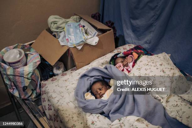 Maurice and Grace, 23-day-old babies, rest in the same hospital room as their mother Furaha Twizire Bukomeye a war-wounded widow in the International...