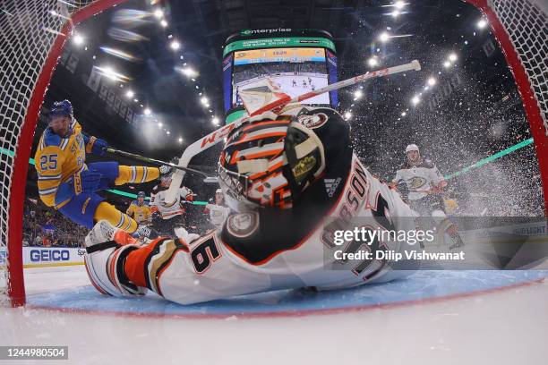 John Gibson of the Anaheim Ducks makes a save against Jordan Kyrou of the St. Louis Blues in the second period at Enterprise Center on November 21,...