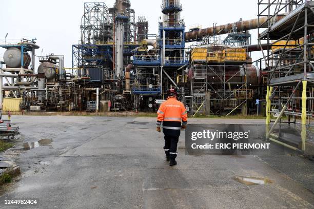 Worker walks at French oil giant TotalEnergies platform on November 21 where a former oil refinery located, as materials are decommissioned and...