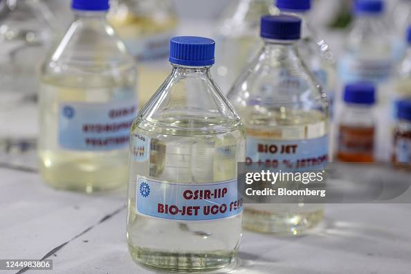 Sample bottles of bio jet fuel made from used cooking oil arranged ...