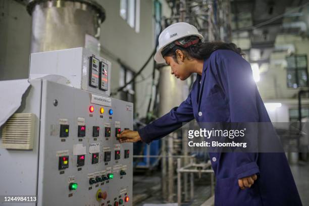 Worker operates the equipment to produce the bio jet fuel at the Council Of Scientific And Industrial Research-Indian Institute of Petroleum in...