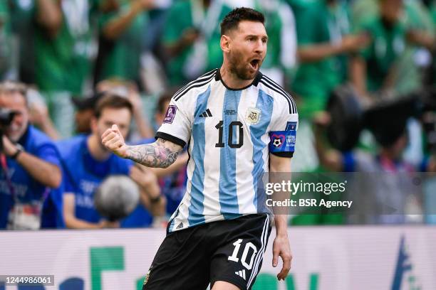 Lionel Messi of Argentina celebrates after scoring his sides first goal during the Group C - FIFA World Cup Qatar 2022 match between Argentina and...
