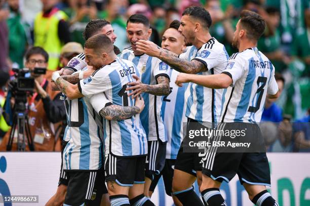 Lionel Messi of Argentina celebrates after scoring his sides first goal with Alejandro Gomez of Argentina, Nicolas Tagliafico of Argentina, Angel Di...