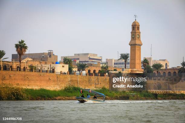 View of a boat on Tigris River, heavily polluted due to chemical waste and garbage dump in Baghdad, Iraq on November 16, 2022. As sewage water;...