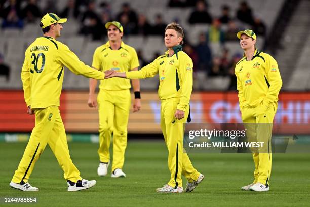 Australia's Adam Zampa is congratualted by teammates Pat Cummins , Sean Abbott and Steve Smith after dismissing England's Moeen Ali during the third...