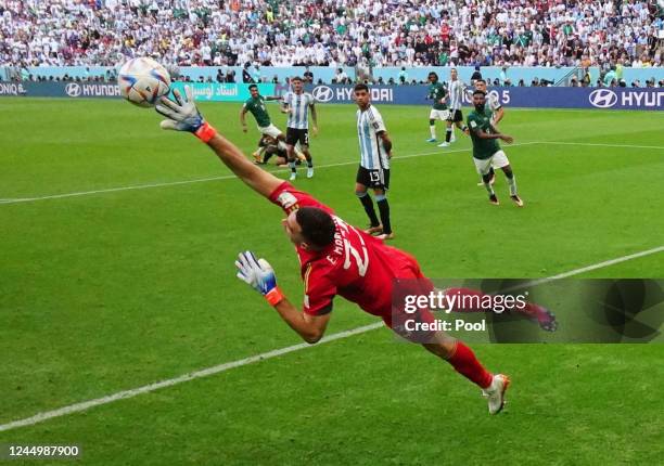 Salem Al-Dawsari of Saudi Arabia scores his team's second goal past goalkeeper Emiliano Martinez of Argentina during the FIFA World Cup Qatar 2022...