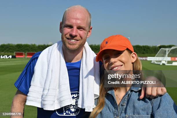 Netherlands' midfielder Davy Klaassen poses with his partner Laura Benschop during a meeting with relatives after a training session at Qatar...