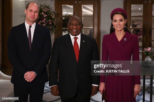 Britain's Prince William, Prince of Wales, and his wife Britain's Catherine, Princess of Wales, pose with South Africa's President Cyril Ramaphosa at...