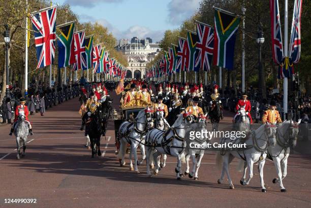 The State Carriage carrying Camilla, Queen Consort, King Charles III and South African President, Cyril Ramaphosa led by a mounted division of the...