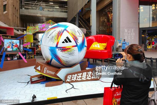 Giant model of the World Cup soccer ball on Nanjing Road attracts visitors to take photos on November 22, 2022 in Shanghai, China. Adidas, which has...