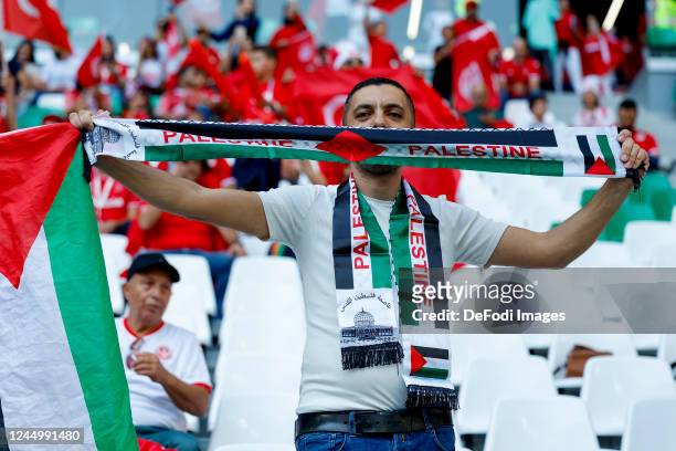 Supporters with flags,banner from Palestine prior to the FIFA World Cup Qatar 2022 Group D match between Denmark and Tunisia at Education City...