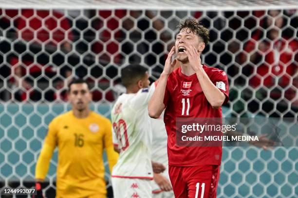 Denmark's midfielder Andreas Skov Olsen reacts after his goal was disallowed for offside during the Qatar 2022 World Cup Group D football match...