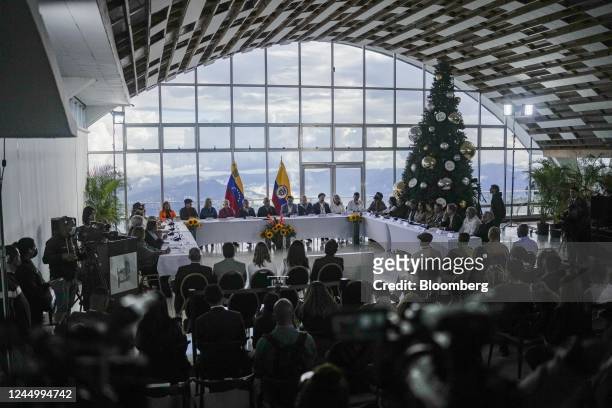 Delegations representing the Colombian guerrilla National Liberation Army , left, and the Colombian government during peace negotiations at the...