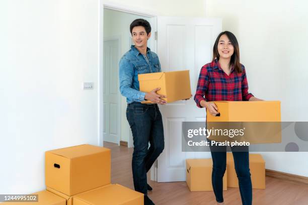 People Holding Box 220 Two People Carrying Big Box Stock Photos, High-Res Pictures, and ...