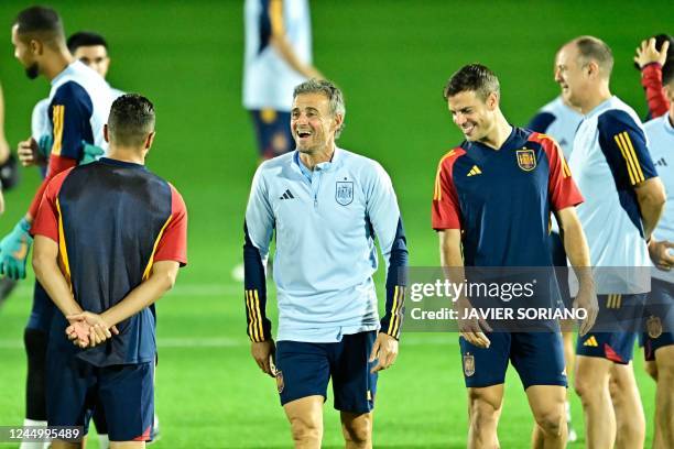 Spain's coach Luis Enrique smiles during a training session at the Qatar University Training ground in Doha on November 22 on the eve of their Qatar...