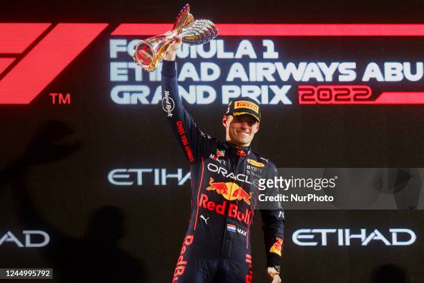 Max Verstappen of Red Bull Racing with a trophy after winnig Formula 1 Abu Dhabi Grand Prix 2022 championship at Yas Marina Circuit on November 20,...