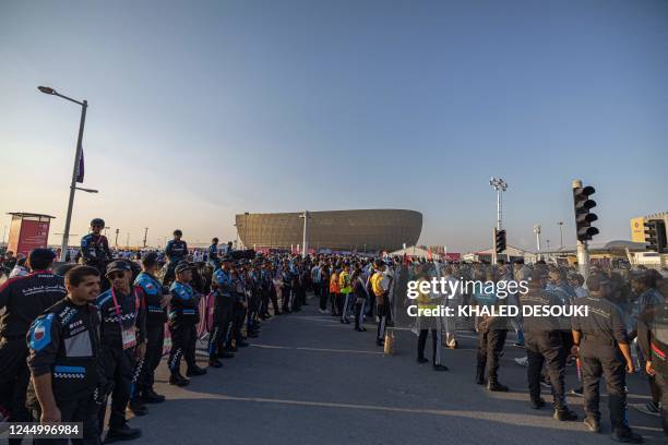 Police officers provide security outside the Lusail Stadium at the end of the Qatar 2022 World Cup Group C football match between Argentina and Saudi...