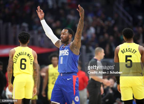 Los Angeles, CA Utah Jazz guards Nickeil Alexander-Walker, left, and Malik Beasley, right, walk away as Clippers point guard John Wall celebrates a...