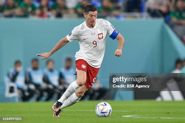 Robert Lewandowski of Poland runs with the ball during the Group C - FIFA World Cup Qatar 2022 match between Mexico and Poland at Stadium 974 on...