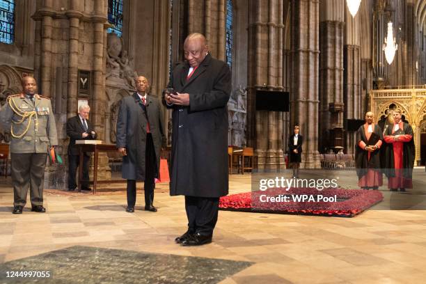 South Africa's President Cyril Ramaphosa takes a picture with his phone of a memorial stone to former prime minister Winston Churchill during a visit...