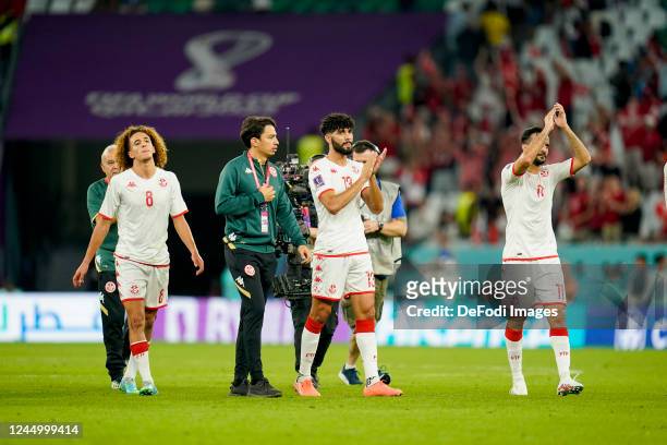 Hannibal Mejbri of Tunisia, Ferjani Sassi of Tunisia and Yassine Khenissi of Tunisia applaud after the match during the FIFA World Cup Qatar 2022...