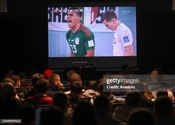 Polish fans watch a group stage match in Group C, Mexico - Poland, in the Fan Zone in front of Krakow's Tauron Arena, November 22, 2022 in Krakow,...