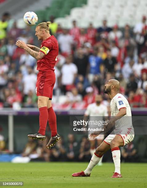 Simon Kjaer of Denmark in action against Issam Jebali of Tunisia during the FIFA World Cup Qatar 2022 Group D match between Denmark and Tunisia at...