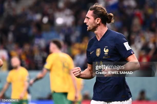 France's midfielder Adrien Rabiot celebrates after he scored during the Qatar 2022 World Cup Group D football match between France and Australia at...