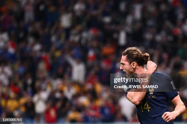 France's midfielder Adrien Rabiot celebrates after he scored during the Qatar 2022 World Cup Group D football match between France and Australia at...