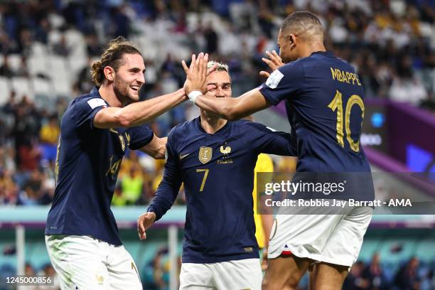 Kylian Mbappe of France and Adrien Rabiot of France celebrate after scoring to make it 2-1 during the FIFA World Cup Qatar 2022 Group D match between...