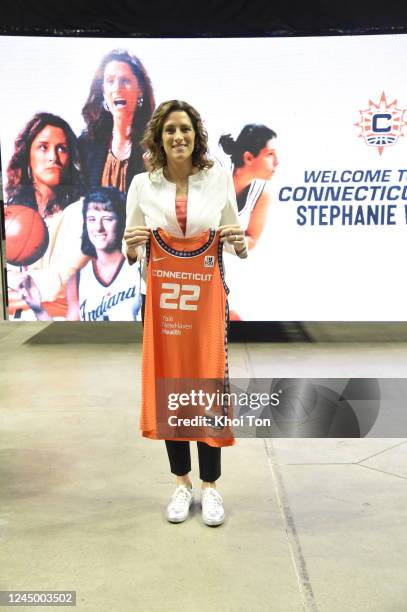 Stephanie White holds up a jersey during a press conference announcing White as the new head coach of the Connecticut Sun on November 22, 2022 at...