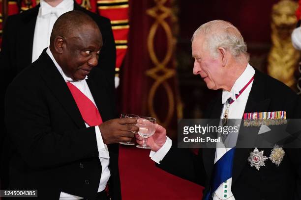 President Cyril Ramaphosa of South Africa and King Charles III share a toast during the State Banquet at Buckingham Palace during the State Visit to...