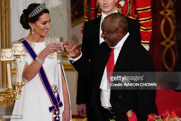 South Africa's President Cyril Ramaphosa toasts a glass with Britain's Catherine, Princess of Wales talks during a State Banquet at Buckingham Palace...