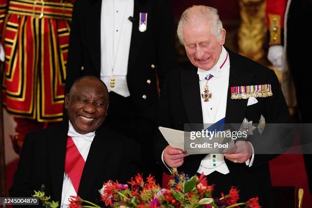 President Cyril Ramaphosa of South Africa laughs as King Charles III speaks during the State Banquet at Buckingham Palace during the State Visit to...