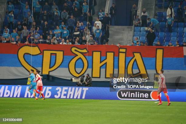 An inscription is seen on the flag of Serbia during the Friendly football match, battle of champions between Zenit Saint Petersburg and Crvena Zvezda...