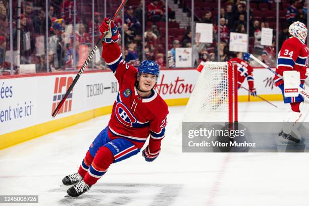 Cole Caufield of the Montreal Canadiens celebrates after a goal during the warm-up of the NHL regular season game between the Montreal Canadiens and...