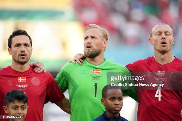 Thomas Delaney, Kasper Schmeichel and Simon Kjaer from L to R of Denmark sing their national anthem prior to the Group D match between Denmark and...